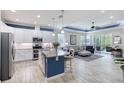 Bright, open kitchen with granite countertops, stainless steel appliances, and seamless flow to living area at 206 St Somewhere Dr, Daytona Beach, FL 32124
