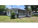 Charming single-story home with black window frames in a residential area at 279 Selden Ave, Ormond Beach, FL 32174