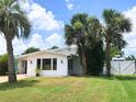Beautifully landscaped yard surrounding a well-maintained home with a view at 33 Camellia Dr, Ormond Beach, FL 32176
