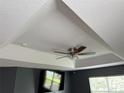 Close-up of ceiling with tray ceiling detail and ceiling fan at 3660 Daydream Pl, St Cloud, FL 34772