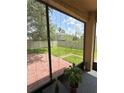 Exterior view from screened-in porch showcasing the lush, fenced backyard at 3660 Daydream Pl, St Cloud, FL 34772
