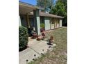 House with planters, flower pots and decor on the front porch at 1561 Copperfield Ave, Deltona, FL 32738