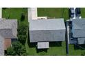 Aerial shot showcases a well-maintained roof and backyard, highlighting the property's overall condition at 1810 Western Rd, South Daytona, FL 32119