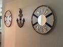Nautical themed decorative art on a wall featuring decorative wooden rings and anchor at 146 Via Madrid Dr, Ormond Beach, FL 32176