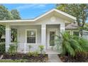 Charming front porch with white railings, offering a cozy outdoor space at 3132 Connemara Dr, Ormond Beach, FL 32174