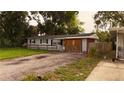 Single-story home featuring fresh paint, a tidy front yard, and wooden garage doors at 1131 Martha Dr, Daytona Beach, FL 32114