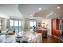 Gourmet kitchen featuring a large island with marble countertop, sleek cabinetry, and stainless steel appliances at 231 Riverside Dr # 1602, Holly Hill, FL 32117
