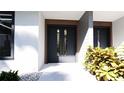 Modern front door design with wood accents and a stylish entrance at 2360 Ocean Shore Blvd # 32, Ormond Beach, FL 32176