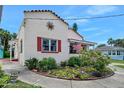 Charming single-story home featuring a beautiful shutters and meticulously maintained landscaping at 918 N Wild Olive Ave, Daytona Beach, FL 32118
