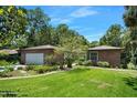 Charming single story brick home with large front yard and lovely landscaping at 1108 Northside Dr, Ormond Beach, FL 32174