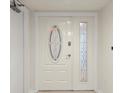 Front door featuring decorative glass inserts for added elegance and natural light at 1239 Ocean Shore Blvd # 3C3, Ormond Beach, FL 32176