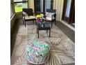 Relaxing screened patio with comfortable seating and stylish outdoor decor at 133 Blue Heron Dr # D, Daytona Beach, FL 32119