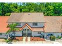 An aerial view of a two-story townhome featuring a red tile roof at 3522 Forest Branch Dr # D, Port Orange, FL 32129