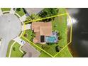 Aerial view showing lot lines with screened in pool and waterfront views at 1904 Rouzbeh Ct, Port Orange, FL 32128