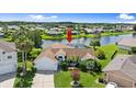 Beautiful aerial view of home with screened lanai with water view at 1904 Rouzbeh Ct, Port Orange, FL 32128