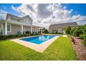 Gorgeous backyard pool area with lush landscaping at 96 Grove St, Ormond Beach, FL 32174