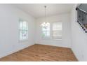 Bright dining room with hardwood floors and chandelier at 10185 Pearson Ave, Orlando, FL 32827