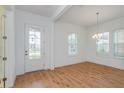 Bright dining room with hardwood floors and chandelier at 10185 Pearson Ave, Orlando, FL 32827