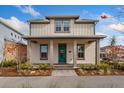 Two-story home with a covered front porch and landscaped yard at 10185 Pearson Ave, Orlando, FL 32827
