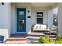 Modern teal front door adds curb appeal to home exterior at 13438 Leggett Aly, Orlando, FL 32827