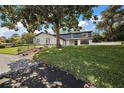Stunning two-story home with a tree-lined yard and updated facade at 1635 Hilltop Dr, Mount Dora, FL 32757
