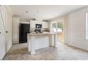 Modern kitchen featuring an island and stainless steel appliances at 4422 Cr 690, Webster, FL 33597