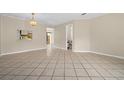 Open dining area with tile floors and access to kitchen at 6299 River Run Pl # 198, Orlando, FL 32807