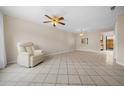 Bright living room with tile floors and ceiling fan at 6299 River Run Pl # 198, Orlando, FL 32807