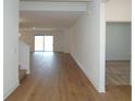 A bright and airy living space with wood floors and neutral walls at 2311 Juniper Berry Dr, Minneola, FL 34715