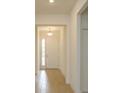 Light and airy entryway with tile floors and white door at 5807 Wallis Ln, Saint Cloud, FL 34771