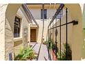 Welcoming courtyard entrance with a charming gate and lush greenery at 1111 Lakeshore Dr # A3, Eustis, FL 32726