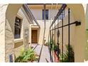 An inviting front entrance featuring manicured plants and a black metal gate at 1111 Lakeshore Dr # A3, Eustis, FL 32726
