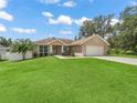 Charming single-Gathering home with a well-maintained lawn and a welcoming facade at 8830 Se 161St Pl, Summerfield, FL 34491