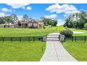 Home with gated entrance and large yard at 15634 Vista Verde Dr, Montverde, FL 34756