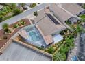 Aerial view of home featuring solar panels and screened-in pool at 3114 Jemima Ave, The Villages, FL 32163