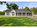 Charming single story home featuring a large screened porch and well-maintained front yard at 7313 Stetson Dr, Clermont, FL 34714