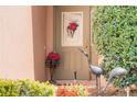 Close-up of a beautifully adorned front door with decorative accents and a welcoming entrance at 3506 Mulberry Grove Loop, Leesburg, FL 34748