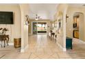 Open-concept floor plan with a view of the kitchen, backyard, and a tiled floor at 15921 Hanson View Dr, Tavares, FL 32778