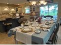 Elegant dining room showcasing a table set for a formal dinner at 557 Dowling Cir, Lady Lake, FL 32159