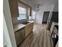 Kitchen features stainless steel appliances and light wood cabinets at 9215 Sw 90Th St, Ocala, FL 34481