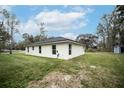 Freshly painted home with a generous backyard and new roof at 2482 County Road 423, Lake Panasoffkee, FL 33538