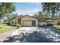 Single story home with carport and large yard at 28432 Tammi Dr, Tavares, FL 32778