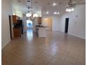 Kitchen with island and stainless steel appliances at 8590 Se 157Th Pl, Summerfield, FL 34491