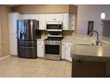 Modern kitchen with stainless steel appliances and ample counter space at 6410 Tildon Ct, Leesburg, FL 34748