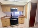 Charming kitchen featuring an updated oven and view to the backyard pool at 1415 Harnden W Rd, Port Orange, FL 32129