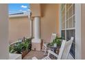 Inviting porch with rocking chairs, perfect for relaxing and enjoying the outdoors at 13129 Coldwater Loop, Clermont, FL 34711