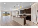 Open concept kitchen island, great for entertaining, with breakfast bar and stainless steel appliances at 555 Meadow Pointe Dr, Haines City, FL 33844