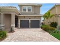 Well-maintained two-story home with tile roof, two-car garage, and landscaped yard at 15615 Vetta Dr, Montverde, FL 34756