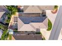 Top-down view of a house showcasing the roofline, backyard, and driveway at 547 Richburg St, The Villages, FL 32162