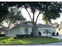 Charming single-story home featuring a well-maintained lawn and a two-car garage at 4088 Kingsley St, Clermont, FL 34711